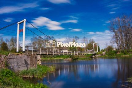 Suspension Footbridge Over the Põltsamaa River on a Clear Spring Day